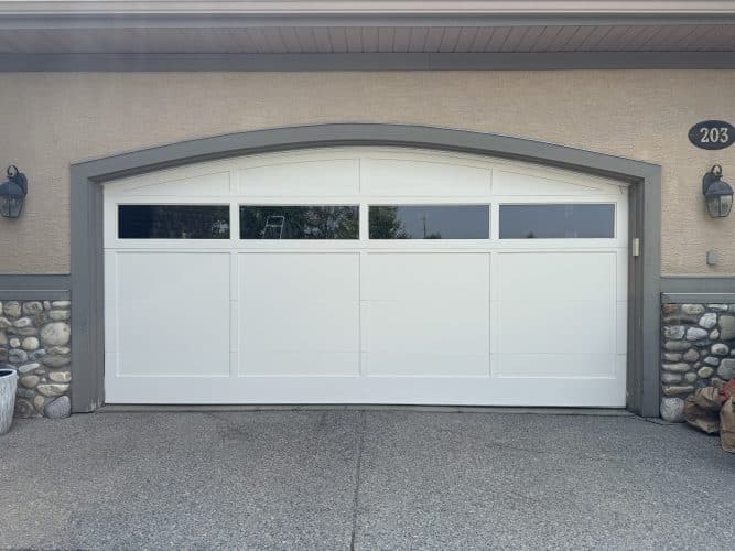 Wood garage door after repainting in Elbow Valley