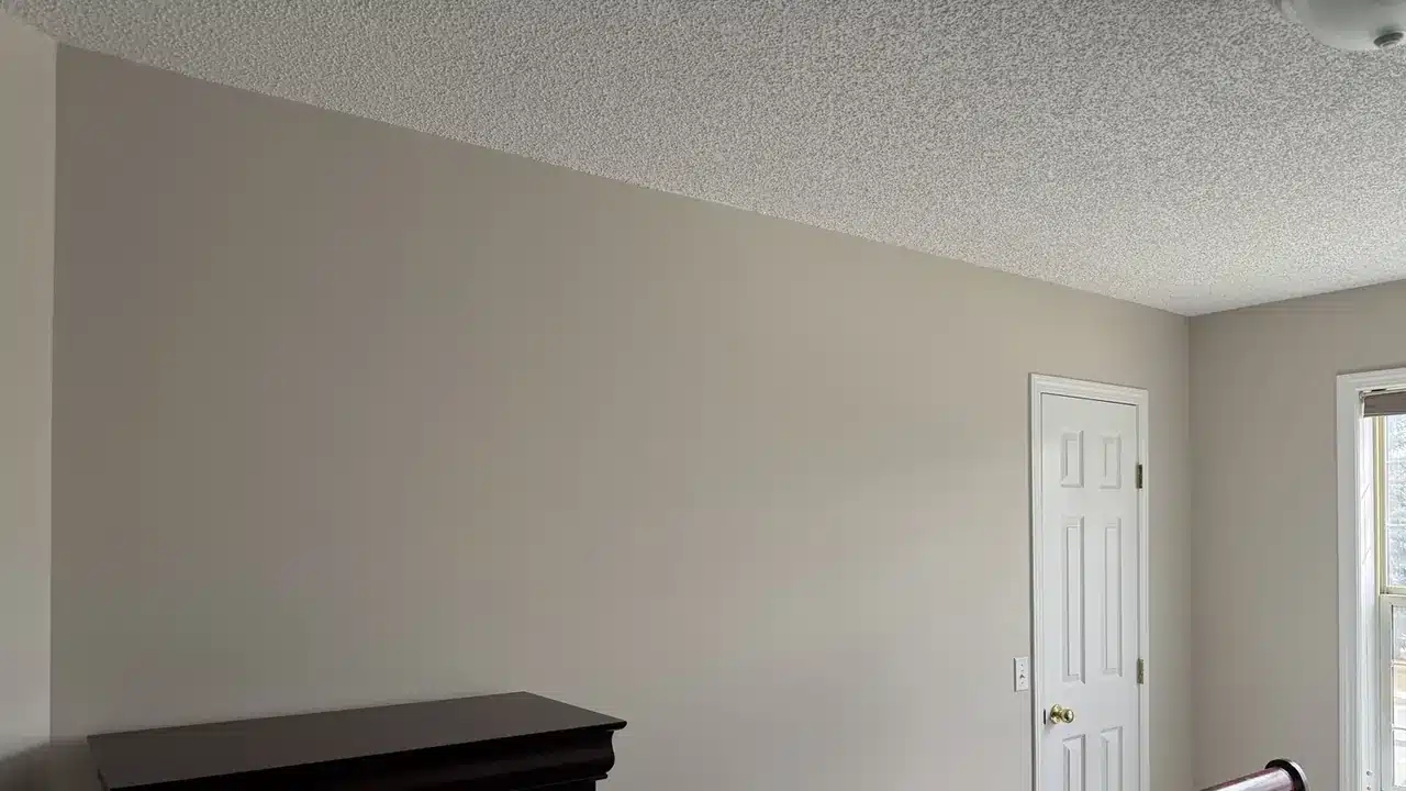 Freshly spray-painted textured bedroom ceiling